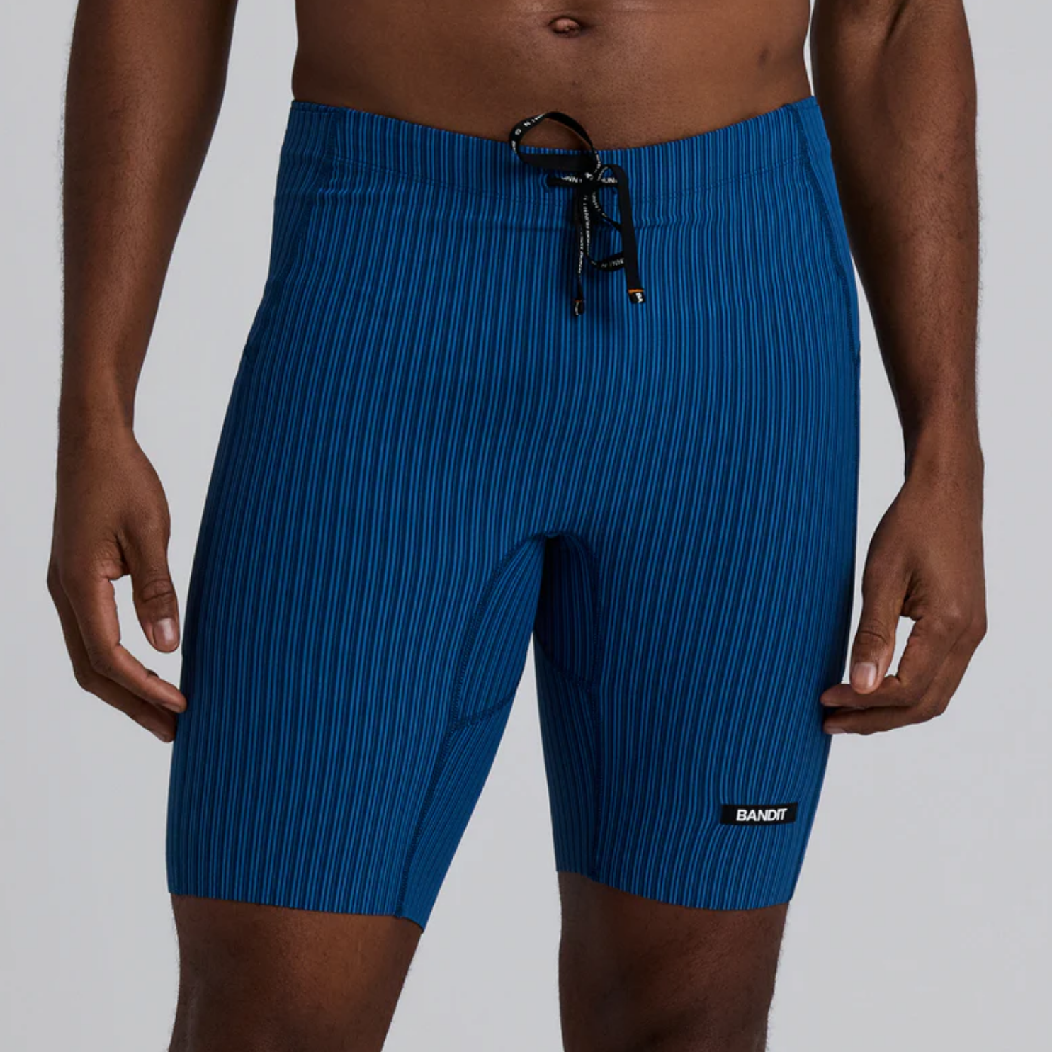 Bandit Running Striped Cadence™ 7 Pocket Lined Half Tights - Ink Blue/Aegean
